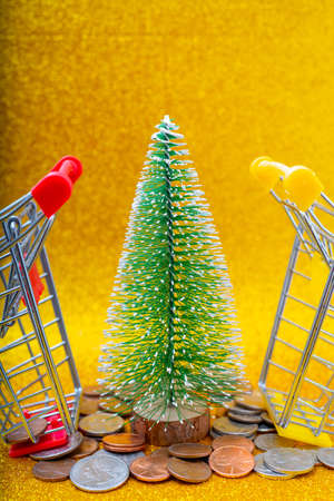 Christmas tree and Metallic American cents. Storage and accumulation of money in the financial system of banks and loans.の写真素材