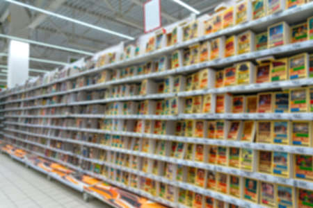 Blurred supermarket background. Selling books in the supermarket.の写真素材