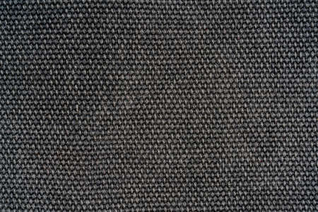 The texture of a dense gray woolen fabric. Close-up textile background.の写真素材
