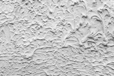 Texture of white plaster. Interior of a modern loft. Abstract rough background. The facade of an old house.の写真素材