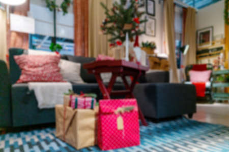 Blurred Christmas background in the room. Christmas tree in the interior of the apartment.