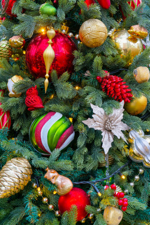 Festively decorated beautiful branches of a Christmas tree.の写真素材