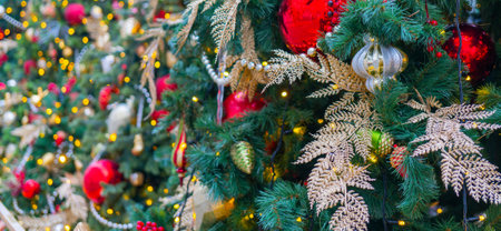 Festively decorated beautiful branches of a Christmas tree.の写真素材