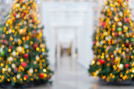 Blurred Festively decorated beautiful branches of a Christmas tree.の写真素材