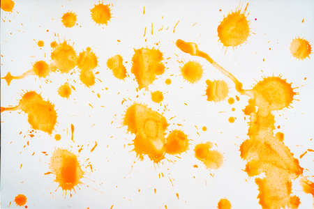 Yellow blots and spots on a white background.の写真素材