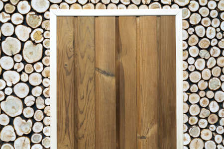 Round wood texture. The wall is faced with untreated wood.の写真素材