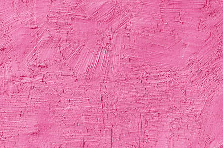 Texture of pink plaster on the wall of an old house. Architectural design.の写真素材