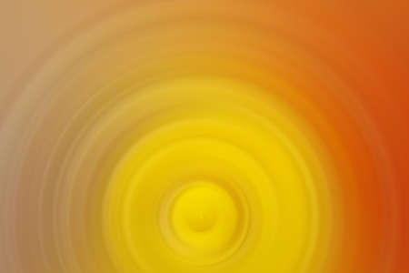 Abstract round yellow background. Circles from the center point. Image of diverging circles. Rotation that creates circles.の写真素材