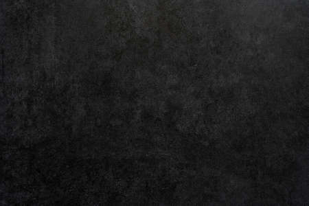 Black rough plaster wall texture. Abstract design background.の写真素材