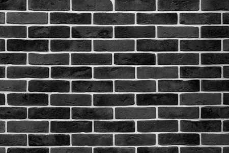 Black brick building wall. Interior of a modern loft. Background for designの写真素材