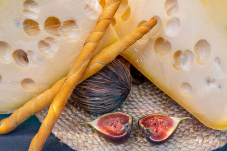 Traditional cheese. Selling farm cheese in a supermarket. Composition of products in the store.の写真素材