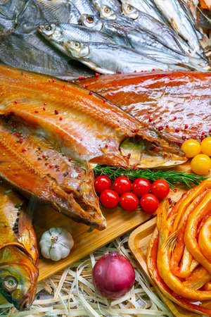 Smoked fish. Selling seafood in a supermarket. Delicious delicacy fish for a festive table.の写真素材