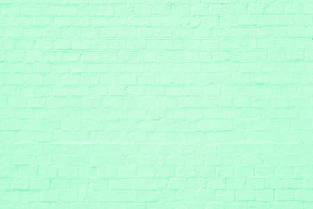 Green brick building wall. Interior of a modern loft. Background for designの写真素材