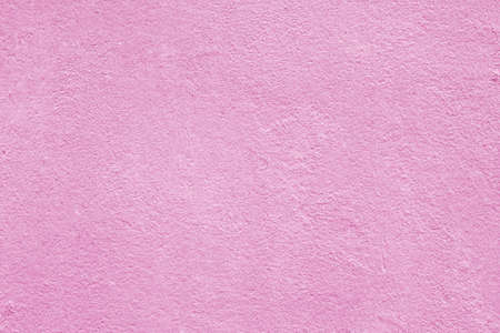 Texture of rough pink plaster. Architectural abstract background.の写真素材