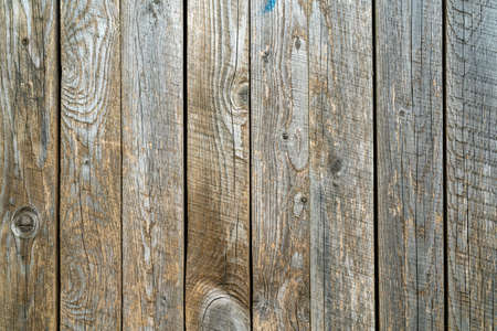 Old wood vintage planks covered with flaky brown paint. Wood texture.の写真素材