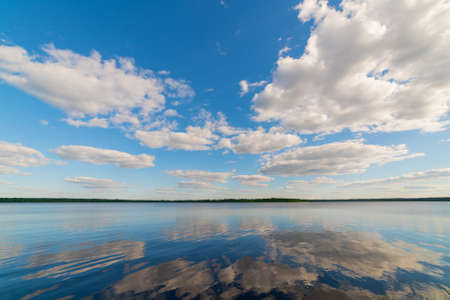 Beautiful white clouds against the blue sky. Summer natural background.の写真素材