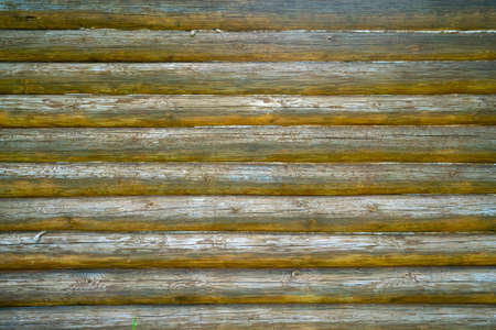 Old wooden logs wall of the house. Vintage wood texture.の写真素材