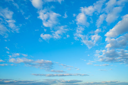 White clouds in the blue sky. Atmospheric natural background.の写真素材