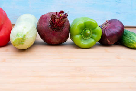 Healthy fresh vegetables on a wooden board for cutting. Healthy lifestyle diet.の写真素材
