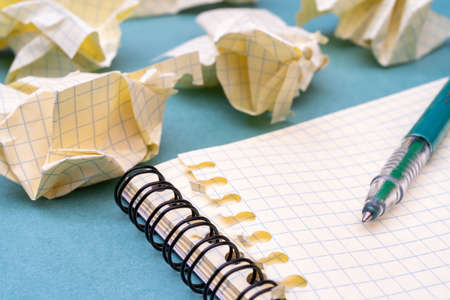Green fountain pen and notepad pages. Preparing for scholarship and education. The torment of creativity.の写真素材