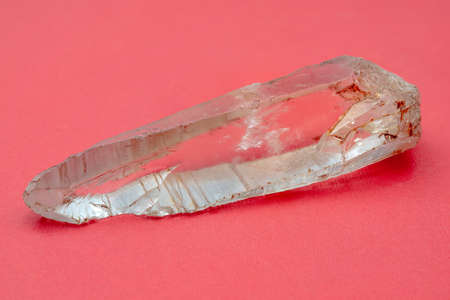 Mountain quartz crystal on a pink background. Mineralogy object.の写真素材