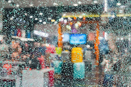 Cracked glass. Broken shop window. Abstract shattered background.の写真素材