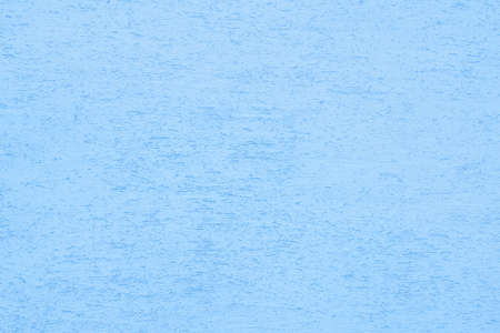 Blue plaster wall of a building. Rough surface texture.の写真素材