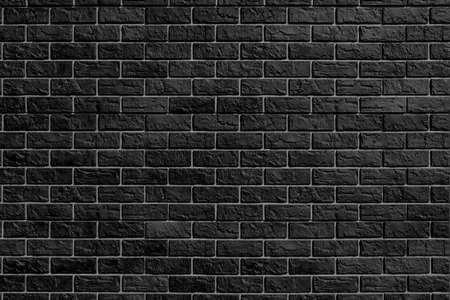 Black brick wall. Modern construction industry. Building's facade.の写真素材