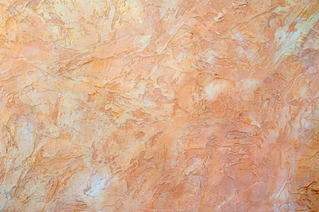 Texture of beige plaster. Rough wall of the building.の写真素材