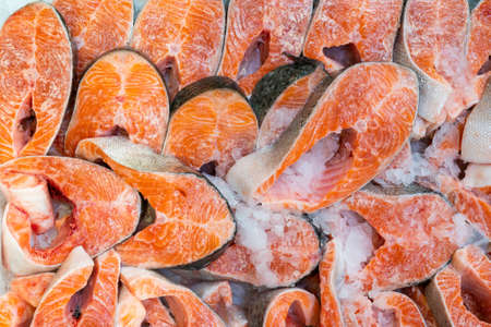 Fresh salmon steaks. Selling seafood in a supermarket.の写真素材