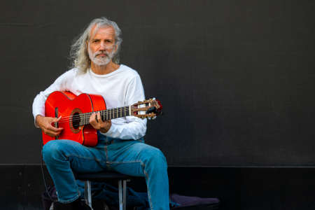 Moscow. Russia. July 31 2021. Old street musician with a guitar.