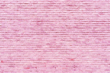 Pink brick wall texture. Building architectural background.の写真素材