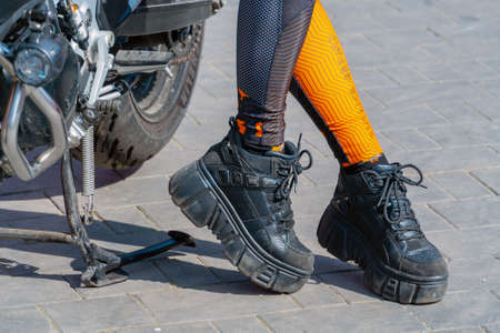 Moscow. Russia. August 14, 2021. A girl in a biker's outfit. Modern motorcycle.のeditorial素材