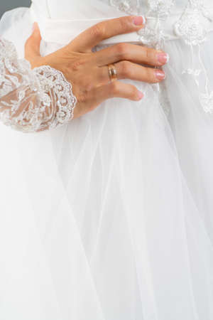 White dress of the bride. Light fabric texture. Traditional wedding wear.の写真素材