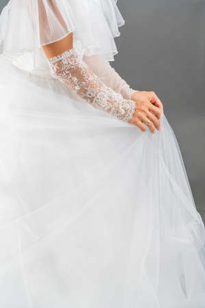 White dress of the bride. Light fabric texture. Traditional wedding wear.の写真素材