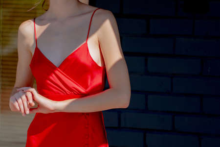 Girl in red clothes. Beautiful female figure.の写真素材