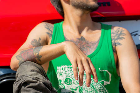 Moscow. Russia. Aug 14 2021. Guy with tattoos on his arms and body.のeditorial素材
