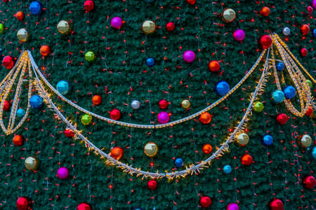 Holiday decorations for the Christmas tree. Blurred holiday background.の写真素材