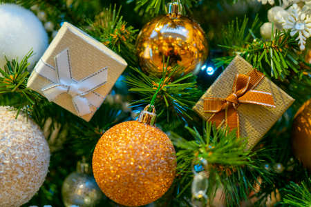 Holiday decorations for the Christmas tree. Blurred holiday background.の写真素材