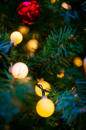 Holiday decorations for the Christmas tree. Blurred holiday background.の写真素材