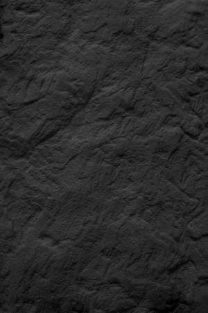 Texture of black rough stone. Natural beautiful surface.の写真素材