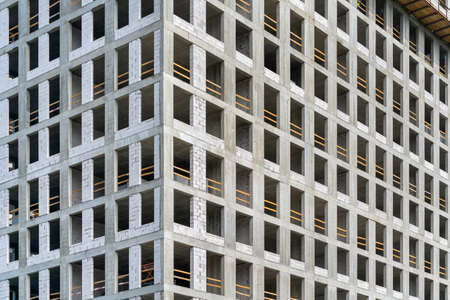 Facade of a house under construction. Modern building industry. Sale and rental of real estate.の写真素材