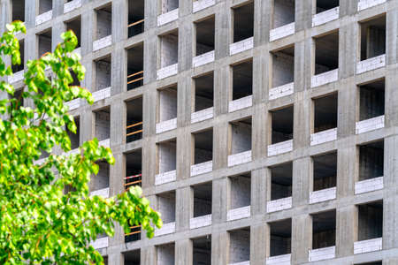 Facade of a house under construction. Modern building industry. Sale and rental of real estate.