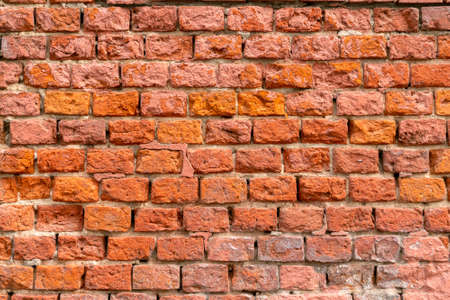 Brick wall of the building. Designer building background.の写真素材