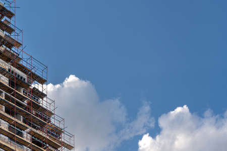 Facade of a house under construction. Modern building industry. Sale and rental of real estate.