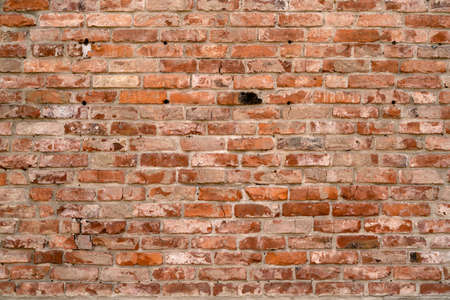 Brick wall of the building. Designer building background.の写真素材
