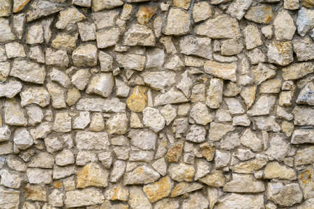 Wall of gray stones. stone building background.の写真素材