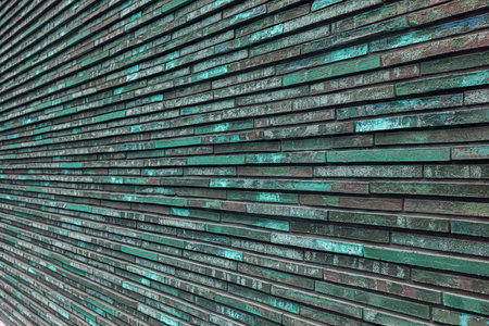 Texture of decorative green brick wall. House faÃ§ade. Wall in the loft.