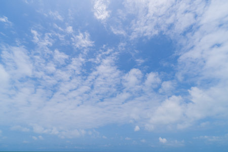 White clouds on the blue sky. Beautiful natural background.
