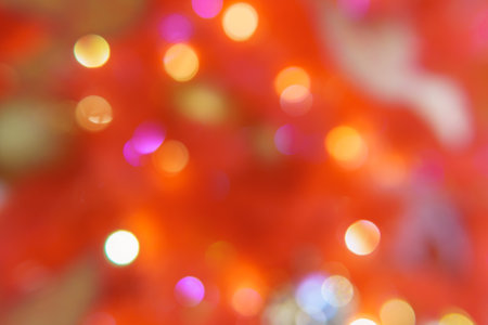 Chaotically placed bokeh circles shine with festive lights. Festive Christmas background.の写真素材